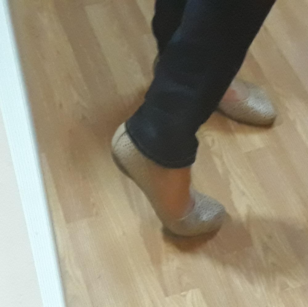 Light tan Clark's perforated flats